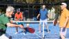 Older adults playing pickleball