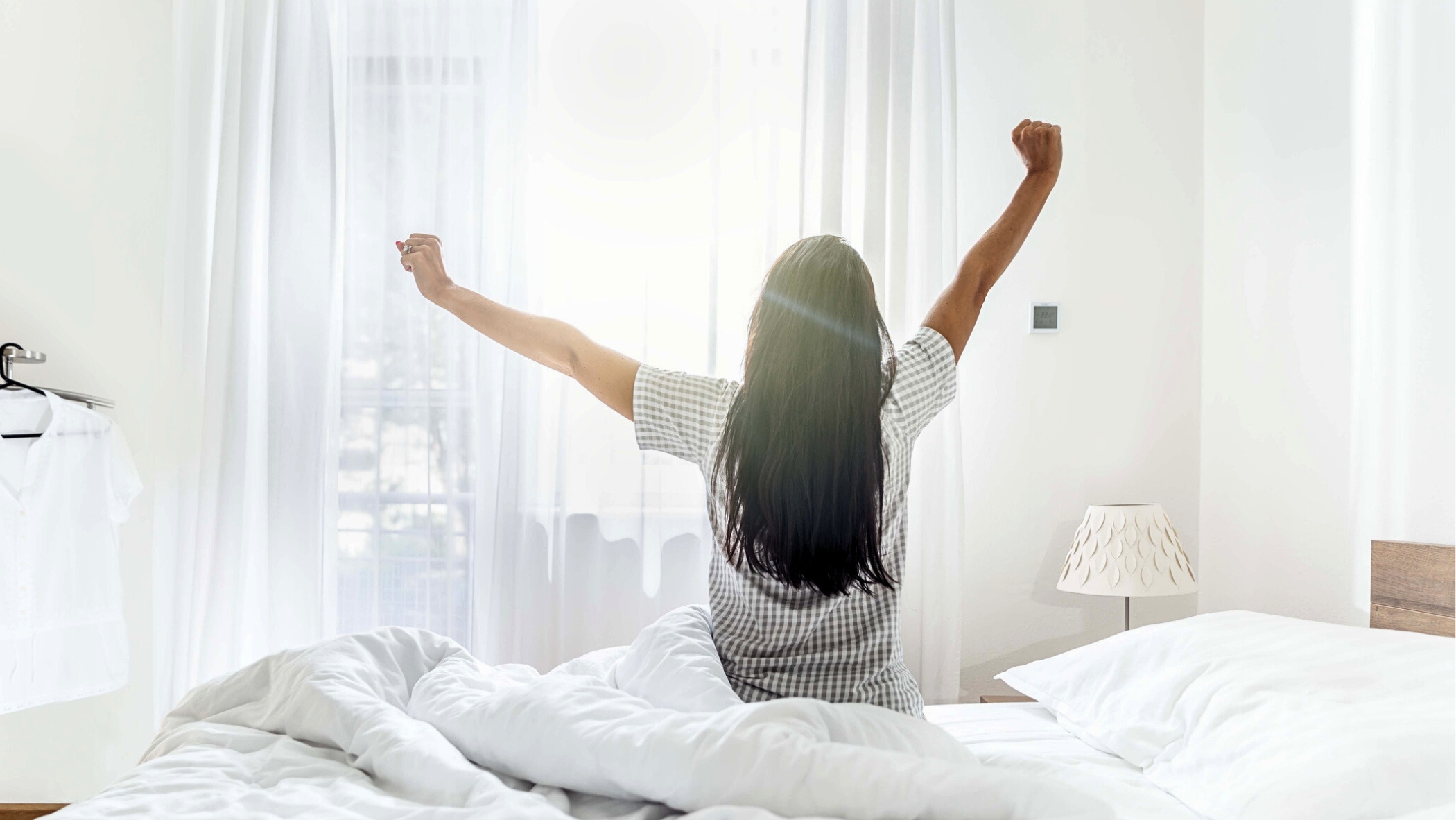 woman waking up refreshed from her sleep