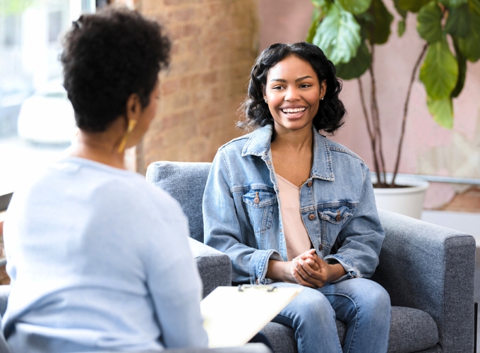 a woman talking to a therapist