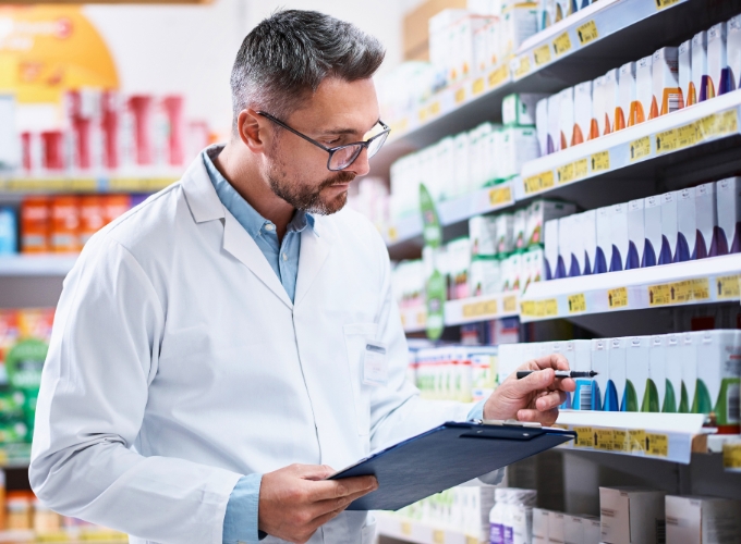 Pharmacist reviewing specialty medication inventory