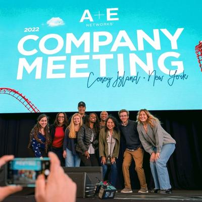 a photo of a group on A+E Networks employees on stage